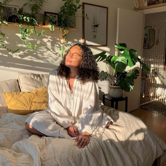 Natalie Doef in her sunny plant filled apartment