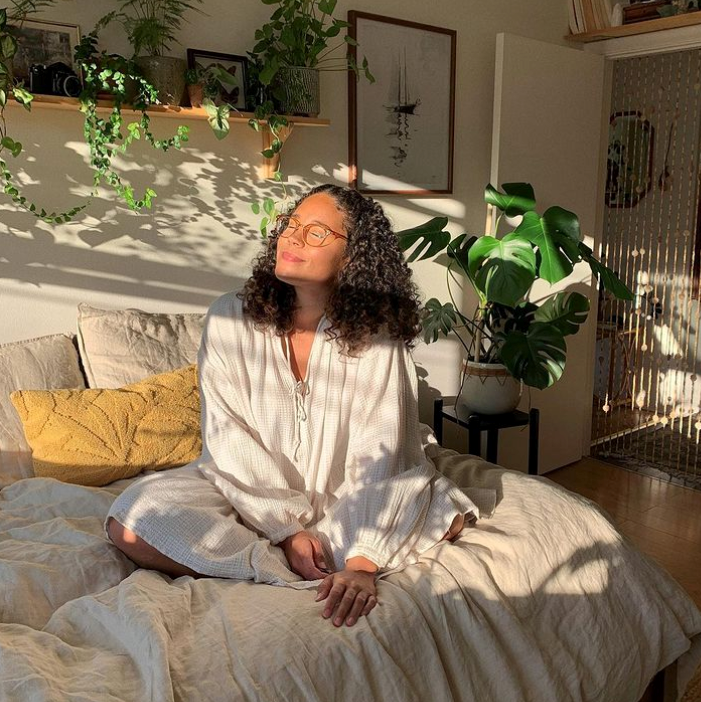 Natalie Doef in her sunny plant filled apartment 